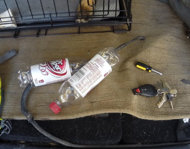 My tools: Empty pop bottles, a screwdriver, keys, and (not pictured) a rubber band. 